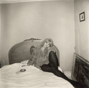 Diane Arbus. Girl in a coat lying on her bed, N.Y.C. 1968