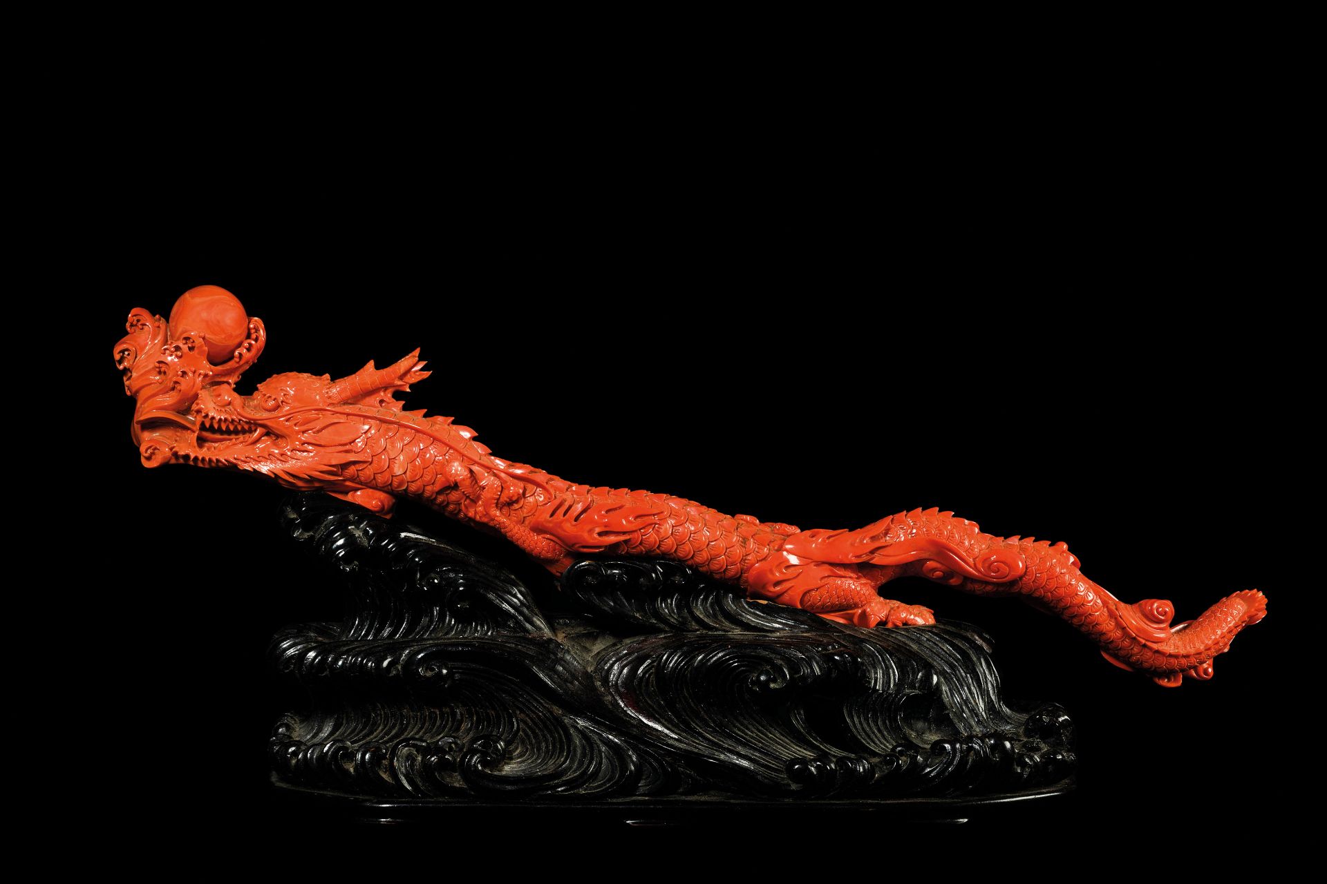 A STUNNING AND IMPRESSIVE IMPERIAL CORAL CARVING OF A DRAGON AND FLEAMING PEARL, 18TH CENTURY EARLY