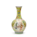 AN IMPRESSIVE RARE PAIR OF LARGE FAMILLE-ROSE YELLOW GROUND DRAGON AND PHOENIX BOTTLE VASES, CHINA,