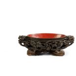 A VERY LARGE OVAL WOOD AND RED-LACQUERED DRAGON BOWL, CHINA, QING DYNASTY, REPUBLIC PERIOD