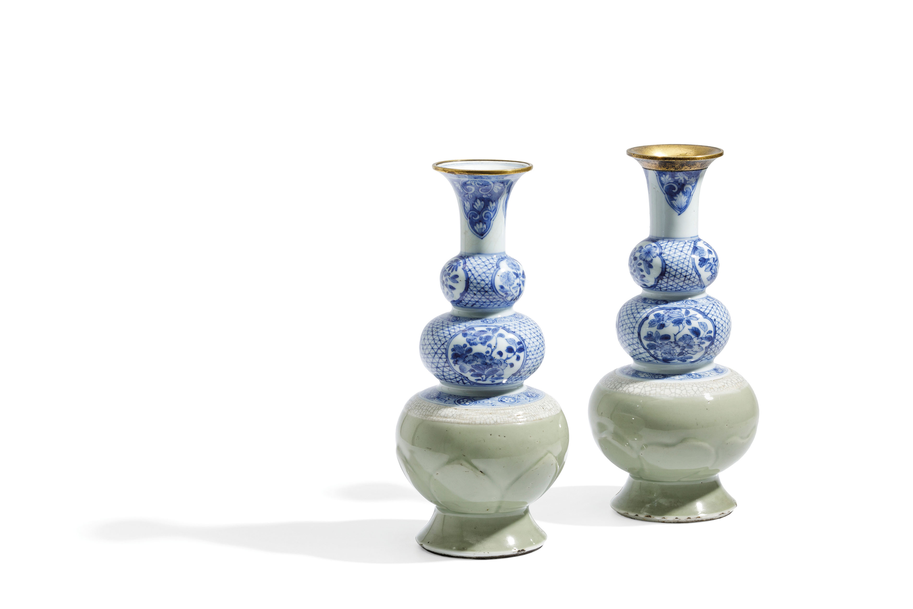 A CLOSE PAIR OF CELADON, BLUE AND WHITE TRIPLE GOURDE VASES (2)