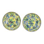 A PAIR OF YELLOW GROUND PORCELAIN SAUCER DISHES, CHINA, 20TH CENTURY, APOCRYPHAL KANGXI MARK (2)