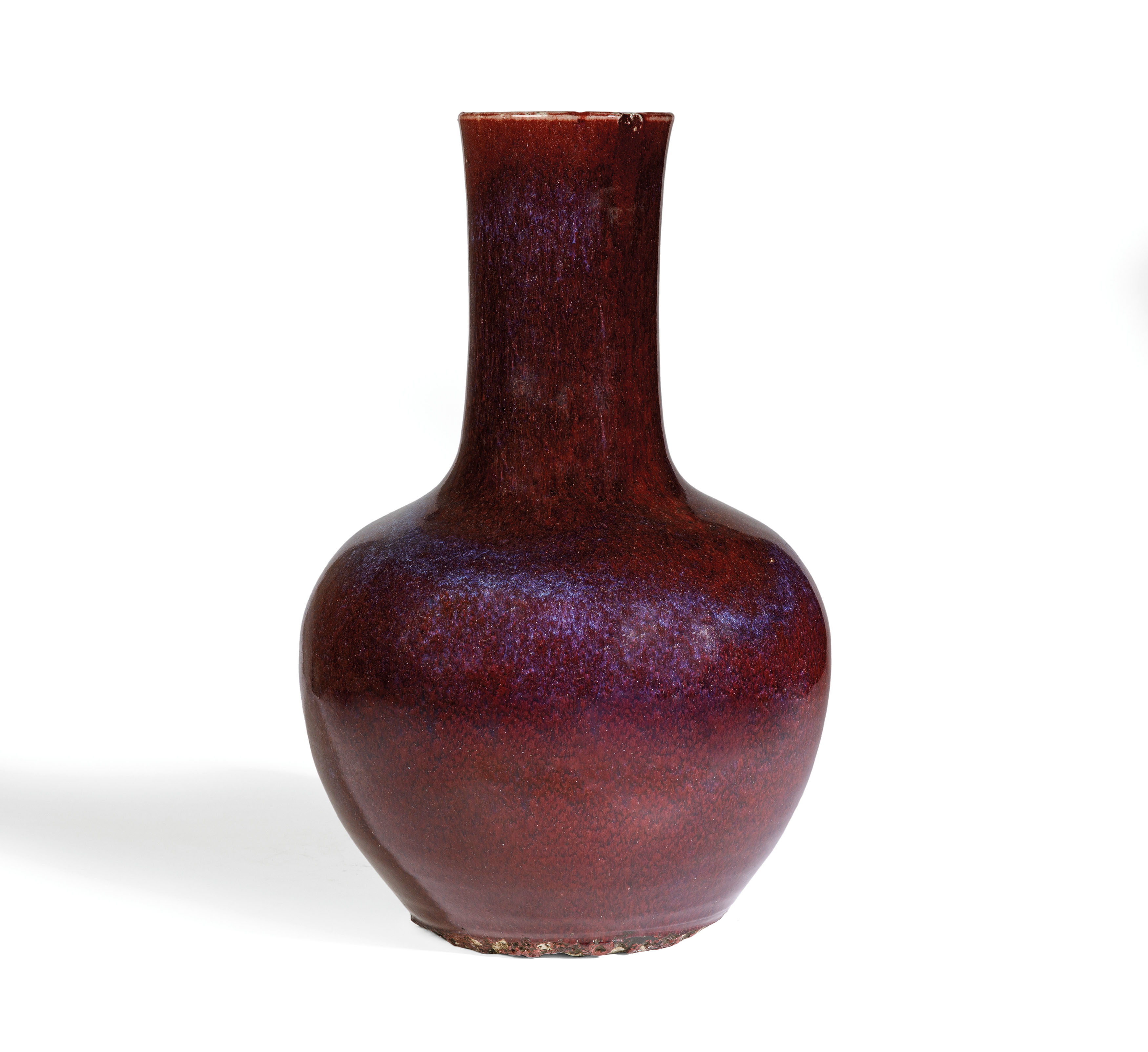 A LARGE FLAMBE'; GLAZED PORCELAIN BOTTLE VASE, CHINA, 19TH CENTURY, APOCRYPHAL MARK KANGXI.