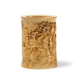 A RARE AND FINE IVORY EIGHTEEN LUOHANS BRUSHPOT, CHINA, QING DYNASTY, 19TH CENTURY