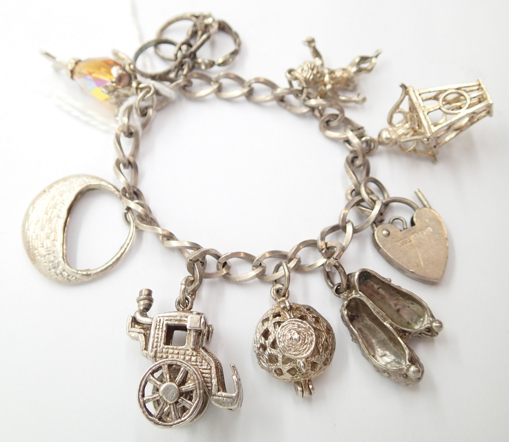 925 silver charm bracelet with seven charms 33g