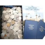 Collection of UK coins including a 1983 coin folder