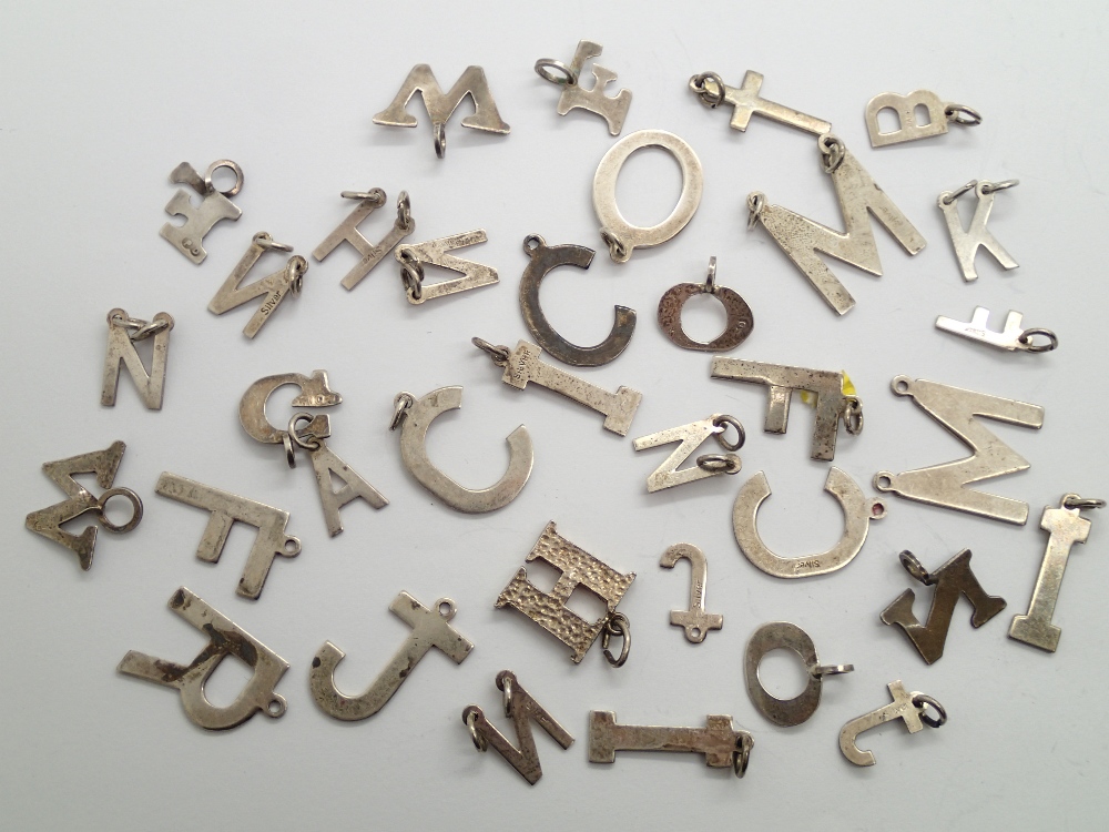 Collection of sterling/925 silver letters of the alphabet pendants
