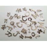 Collection of sterling/925 silver letters of the alphabet pendants