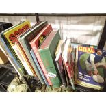 Shelf of football related books and magazines