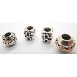 Four authentic Pandora silver bead charms