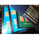 Four albums of world postage stamps