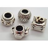 Four authentic Pandora silver bead charms