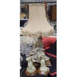 Figural lamp and two matching figurines