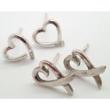 Two pairs of sterling silver heart stud earrings one pair diamond set