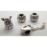 Four authentic Pandora silver bead charms
