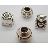 Four authentic Pandora silver charms