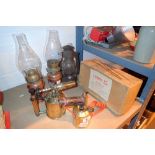 Pair of brass paint strippers and copper spirit lamps with a storm lamp and apple peeler