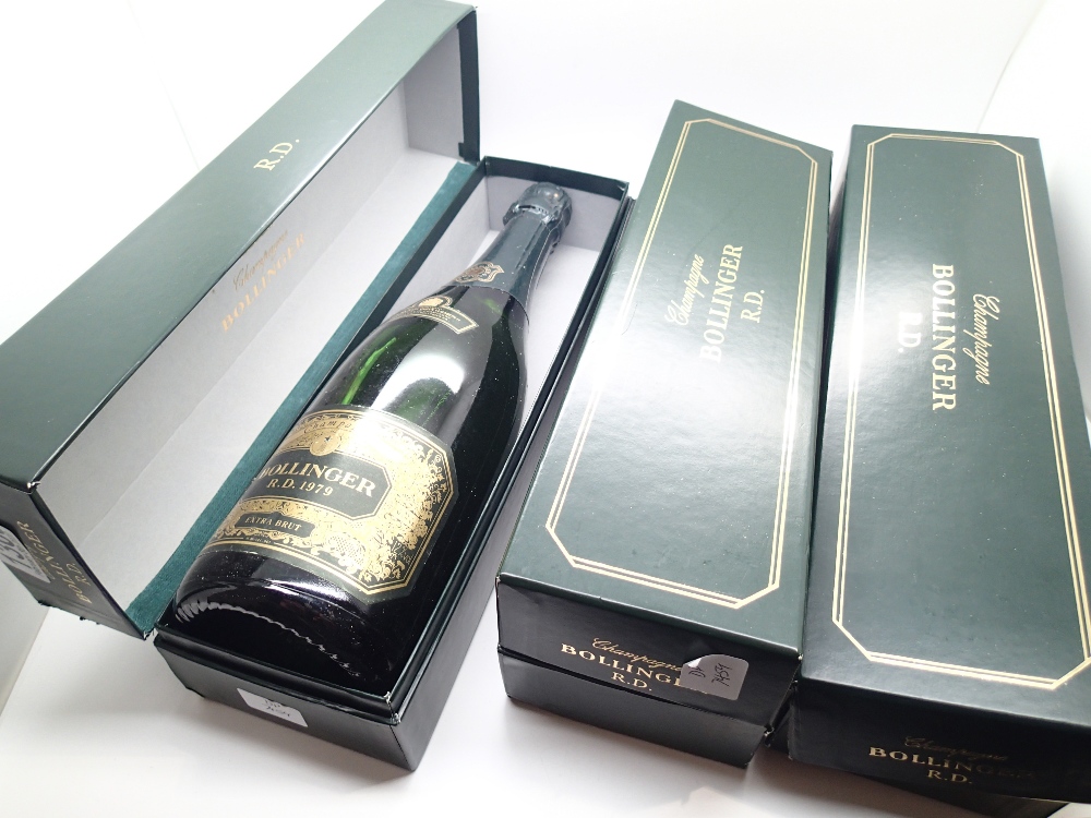 Three boxed presentation bottles of Bollinger champagne RD one 1979 two 1982 (foil and level