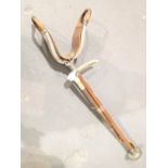 Antler handled braided leather riding crop and a vintage shooting stick