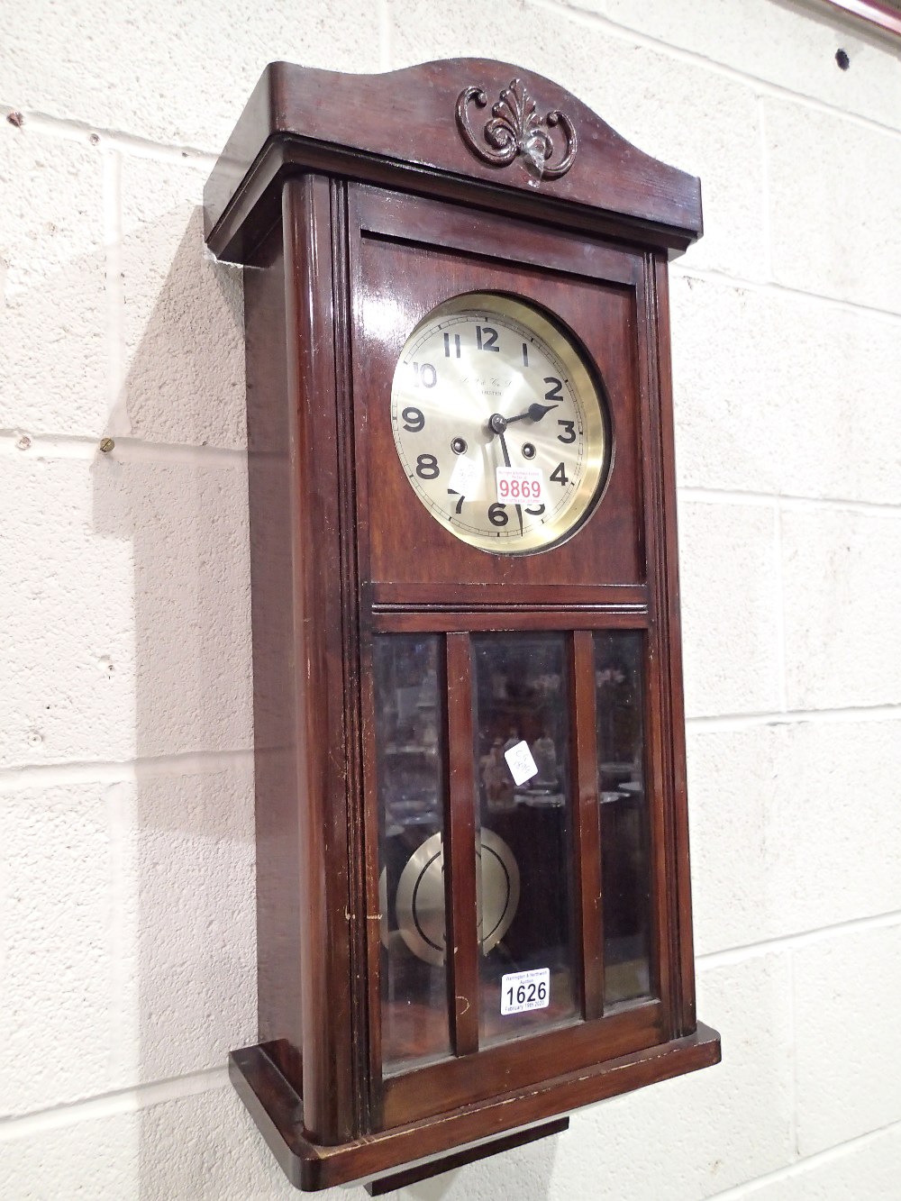 Mahogany wall clock with brass face by Butt and Co Ltd Chester