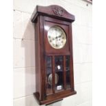 Mahogany wall clock with brass face by Butt and Co Ltd Chester