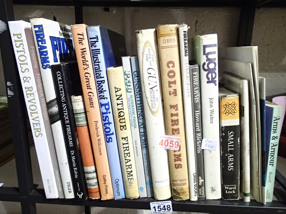 Shelf of books on firearms etc