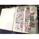 Stock box of mixed worldwide postage stamps
