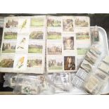 Box of mixed cigarette cards some glued in albums