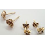 Two pairs of small 9ct gold stud earrings