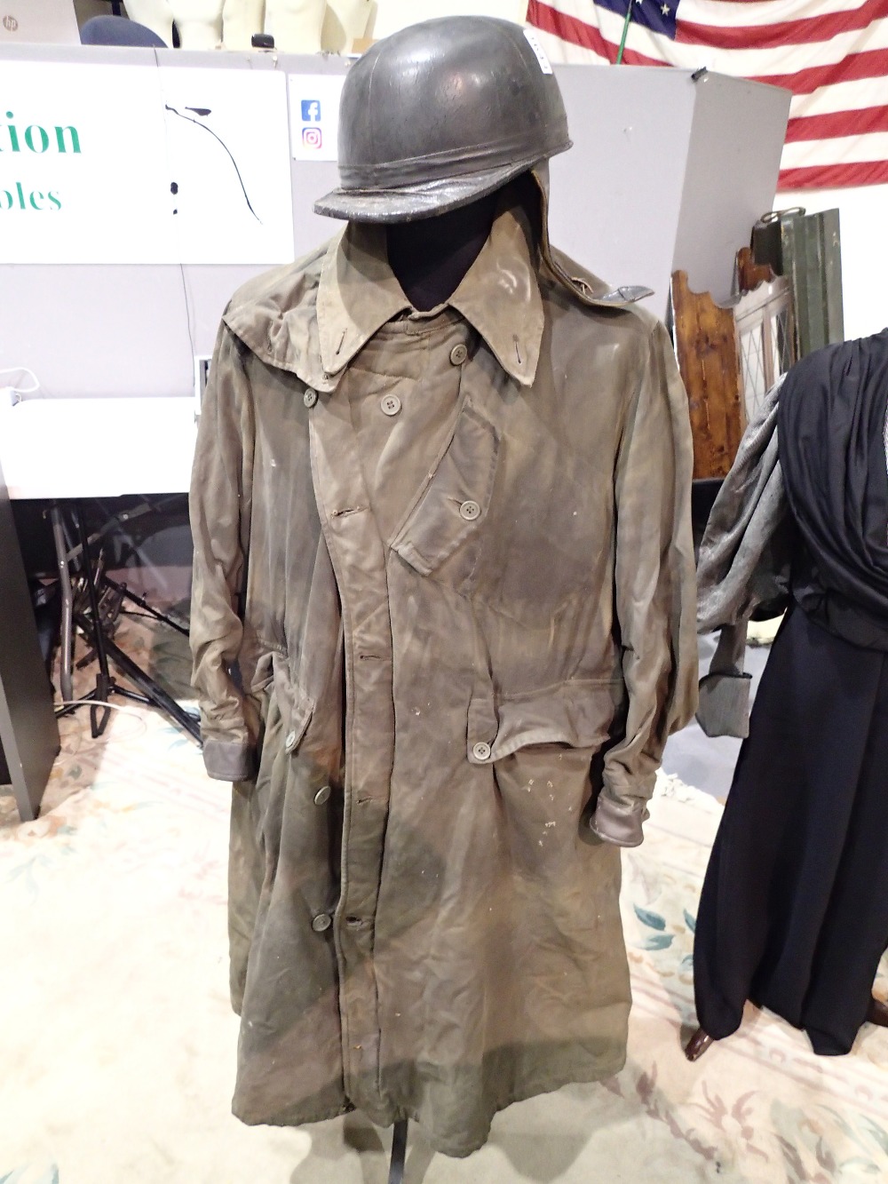 1930s Belstaff Junior TT Stormcoat and a 1930s crash helmet by Chas Owen London (see lot 1301 for