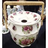 Large slop bowl with cane handle and floral decoration