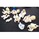 Bisque babies and three pin cushion dolls