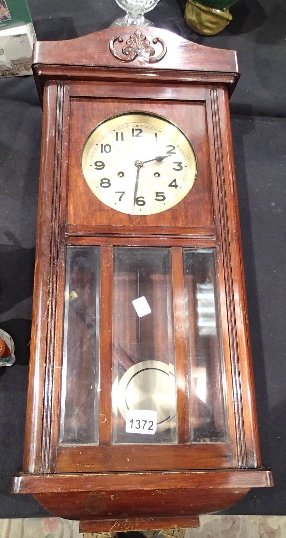 Mahogany wall clock with brass face by Butt and Co Ltd Chester