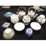 Collection of Oriental teapots, ginger jars,