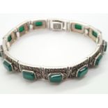 Sterling silver marcasite Art Deco type bracelet set with green stones