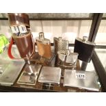 Three bottle leather cased flasks,