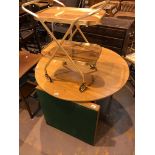 Circular dining table with extending panel with further card table and drinks trolley