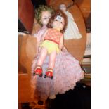 Two retro plastic dolls and a bisque headed antique doll