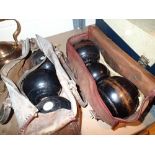 Two sets of bowls with jacks and bags,