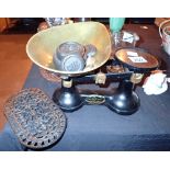 Cast iron scales with weights and a trivet