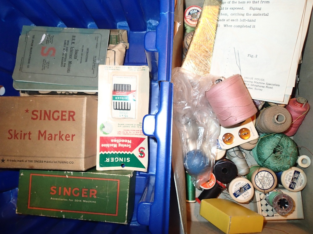 Box of Singer sewing machine accessories and reels of cotton