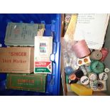 Box of Singer sewing machine accessories and reels of cotton