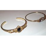 Two yellow metal bangles