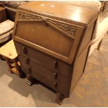Bureau with carved lid and three lower drawers