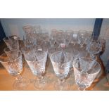 Shelf of mixed Stuart Crystal glasses