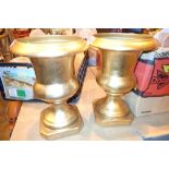 Two brass effect ceramic garden urns