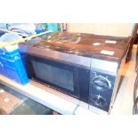 Kitchen microwave in black 700w CONDITION REPORT: All electrical items in this lot