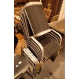 Six stacking garden chairs with a footstool and two other folding chairs