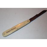 Unusual faux ivory folding medical corn paring knife by Refeat Needham Brothers Sheffield