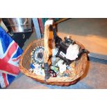 Basket of mixed ceramic figurines and a tea pot